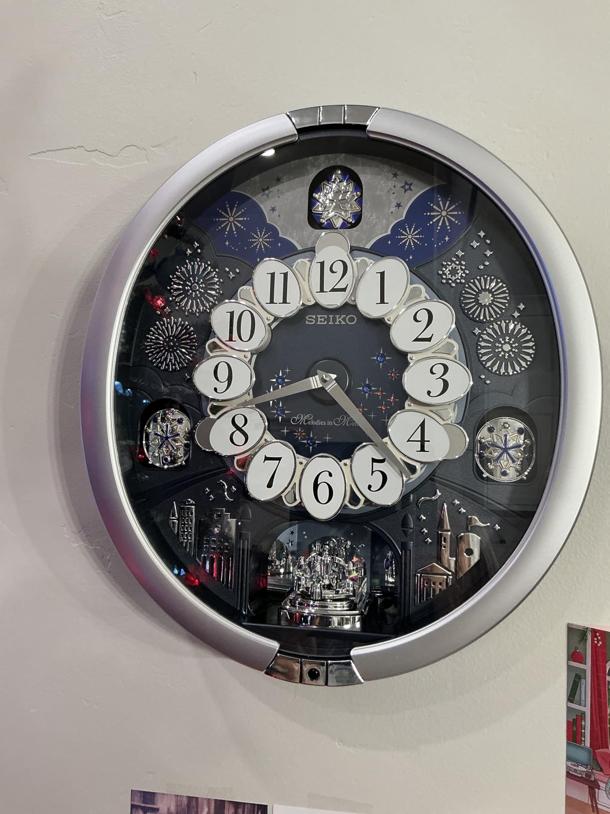 SEIKO QXM379SRH 18 Melodies in Motion Rotating Pendulum Wall Clock, Silver Stars customer photo 1