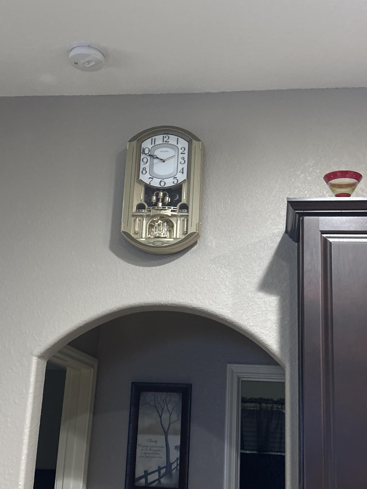 Bulova C4900 Golden Music Wall Clock | Gold-Tone Case with Rotating Crystal Pendulum | 12 Melodies | Adjustable Volume | Night Shutoff customer photo 1