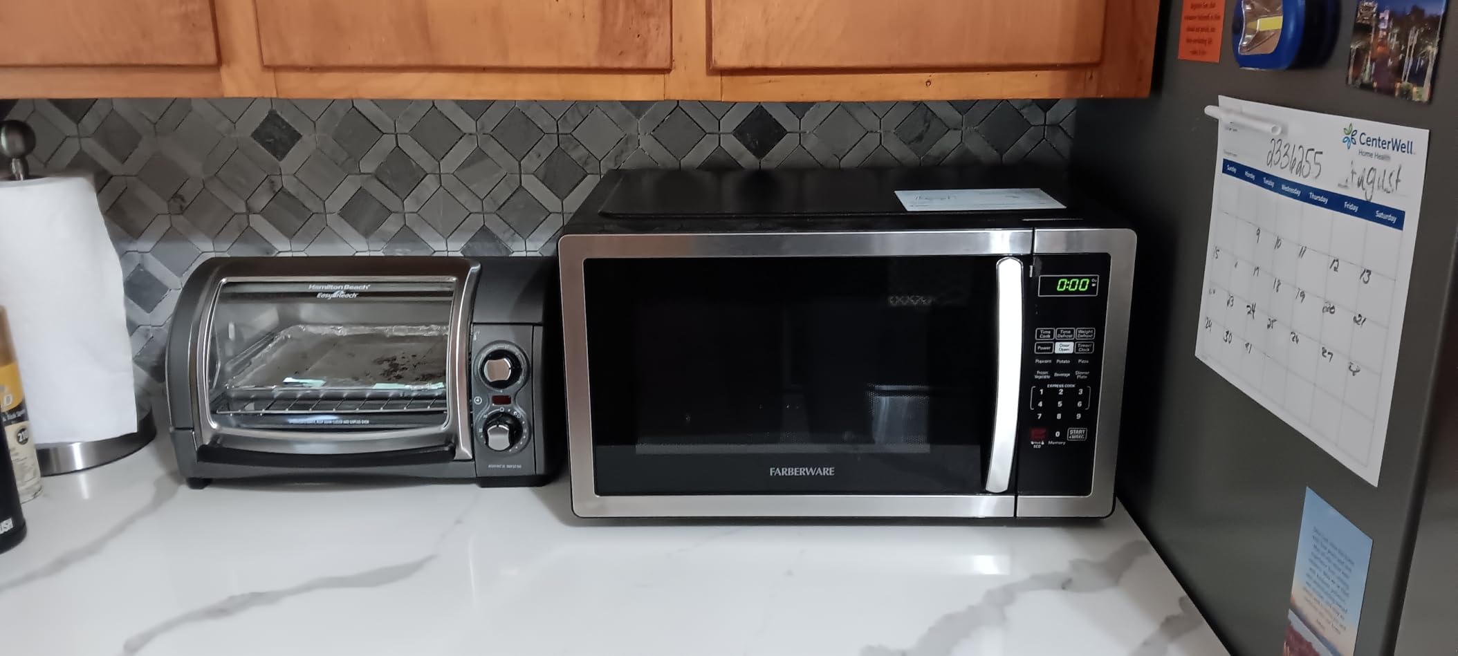 Farberware 1.1 Cu. Ft. Countertop Microwave Oven – 1000 Watts Power, Auto Cook Settings, Defrost, Easy Clean and Child Safety Lock - Stainless customer photo 2