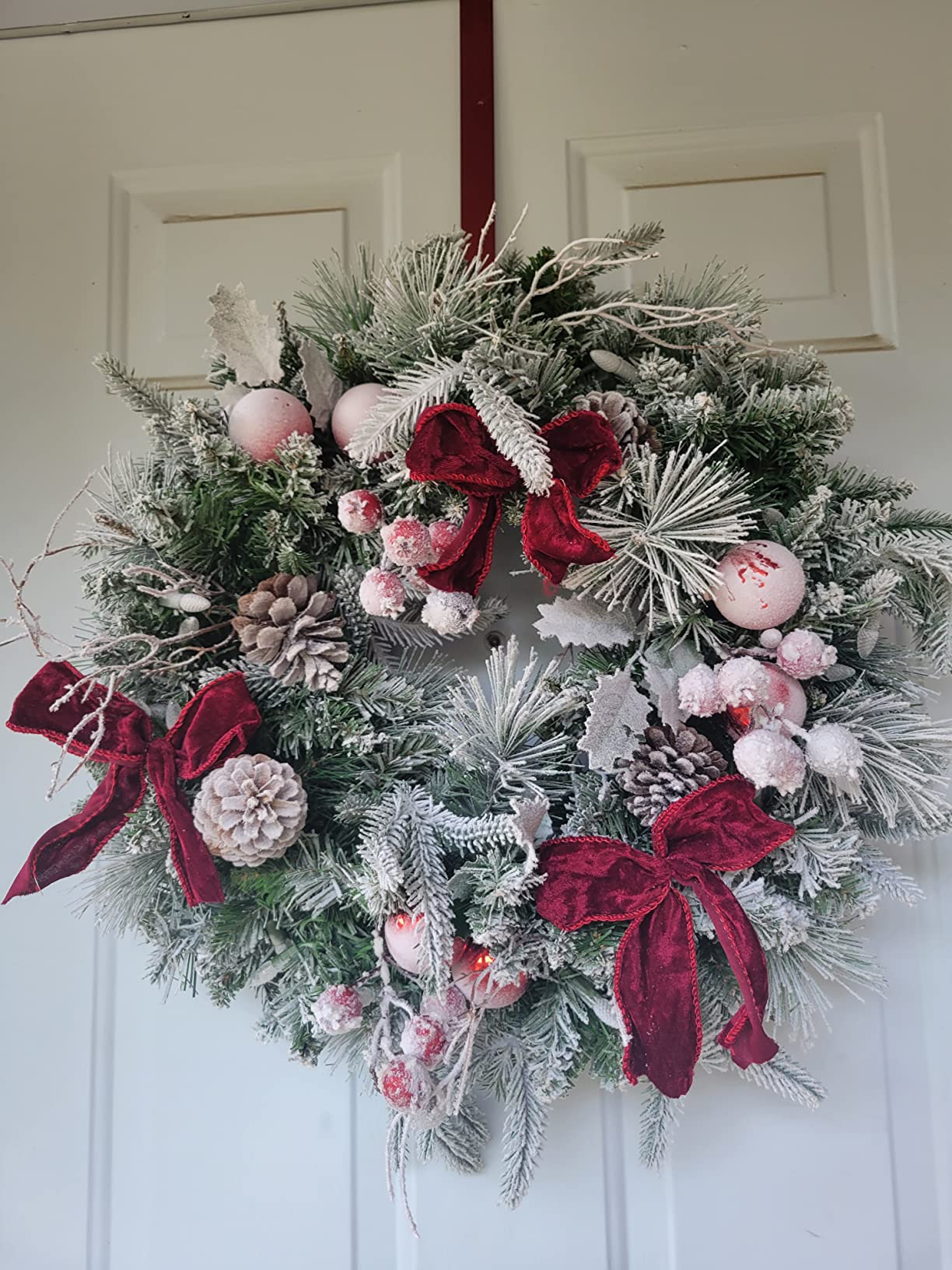 Pre-lit Snow Christmas Wreath with Red Balls,Berries and Bows,24 Inch 50 Battery Operated LED Lights,Holiday Decoration for Front Door Outdoor customer photo 2